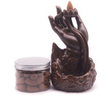 A Hand Holding Flower Design Smoke Backflow Incense Burner - 7.5" Tall