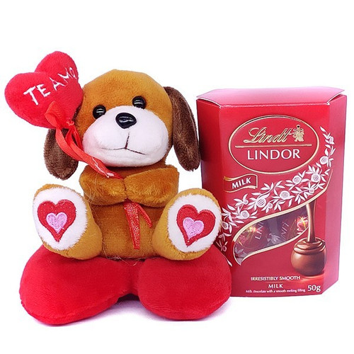 Cute Mini Puppy With Lindt Lindor Milk Chocolate Box
