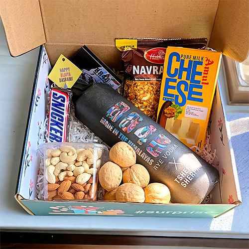 Dashain Delights: Special Tsherin Vodka, Dry Nuts, and Sweets Gift Combo