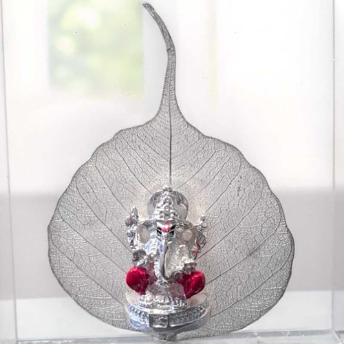 Silver Ganesh Idol Sitting on Beautiful Silver Peepal Leaf Giftmandu