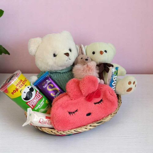 This delightful hamper filled with soft cuddles & sweet treats For Her