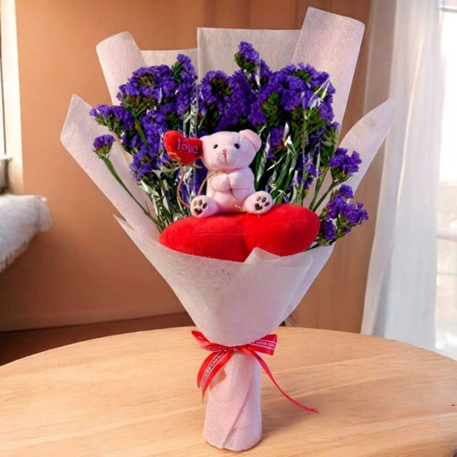 Cute Pink Teddy on Heart Cushion Bouquet With Purple Gypsy