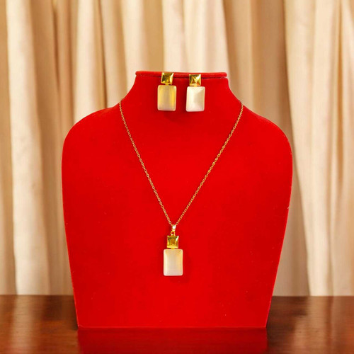 Elegant Gold-Tone Brass Jewelry Set Featuring White Gemstone Pendant with Metallic Shine JL-101