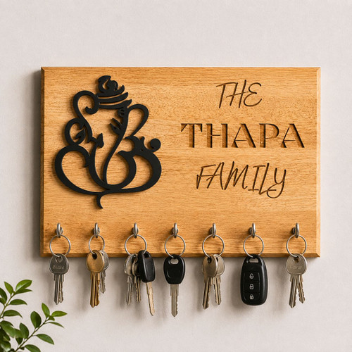Decorative Wooden Key Holder with Ganesh Cutout and Engraved Family Name