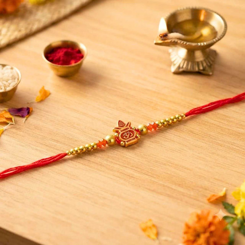 Classic Om Rakhi with Red Thread & Golden Beads RT-1161