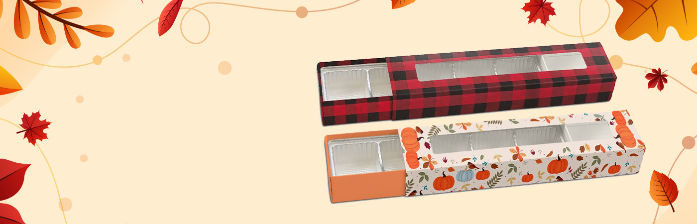 Fall-themed slider boxes filled with seasonal treats like chocolates and caramels