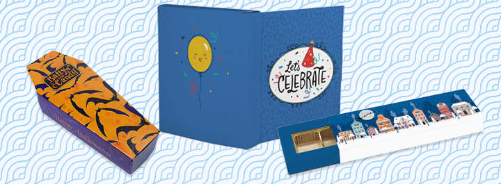 Holiday gift boxes featuring a Santa chimney design and a floral heart Valentine's design.