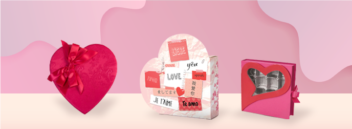 Heart-shaped fabric gift box with a red ribbon and white heart pattern.