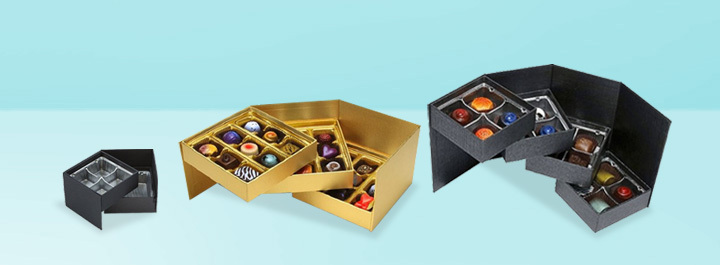 Tiered candy and chocolate boxes with stair-step compartments for premium presentation.