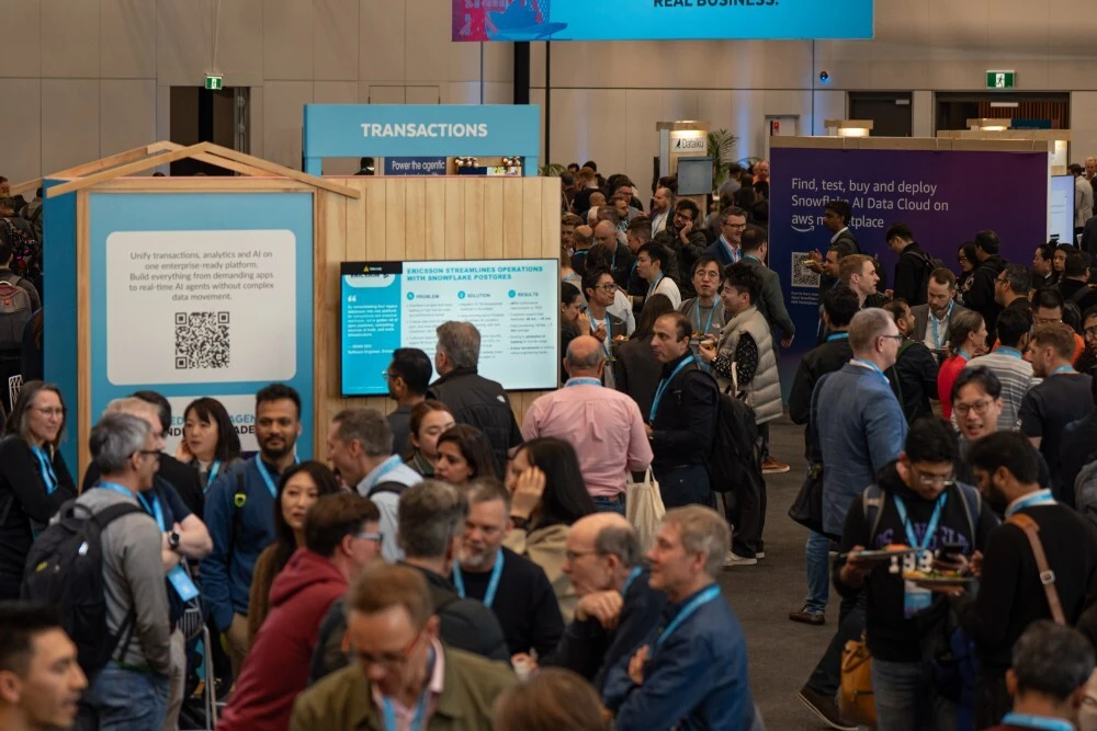 Busy Snowflake World Tour Auckland event floor with technology demo environments and attendee engagement