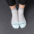 Teal Blue Cat Toe Socks with Gray and White stripes.