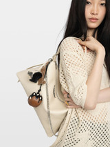 Designer Grained Leather Handbag in White with Chain and Wing Motif