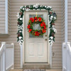 Pre-lit garland wrapped along a staircase banister with soft warm lighting, enhancing traditional holiday interior decor.