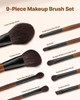 Full 9-piece makeup brush set laid out neatly with zippered travel bag on marble vanity top