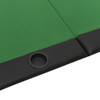 Close-up of premium poker table surface showing green felt, card deck, clay chips, and stitched black faux leather armrest