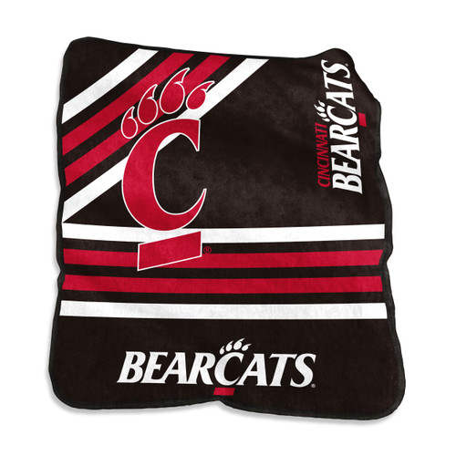 Cincinnati Bearcats 50×60 plush Raschel throw blanket folded neatly on a bed, showcasing bold NCAA licensed team logo in red and black on ultra-soft fabric, ideal for dorm rooms, gifts, and game-day comfort