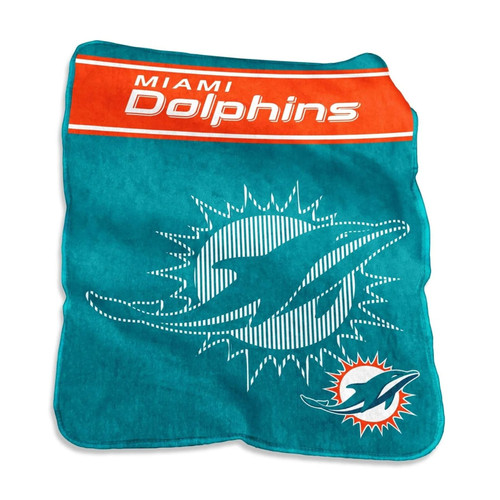 Official Miami Dolphins 60×80 Raschel Throw Blanket draped over a modern gray sofa, showcasing vibrant team colors and bold logo design, emphasizing oversized plush comfort for game-day lounging or home décor.