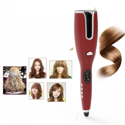 Woman using Go Curly USB Automatic Hair Curler in a brightly lit bathroom, smiling as soft curls form around her face — cordless ceramic hair tool in action with visible curling barrel and glowing LED indicator.
