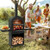 Outdoor pizza oven on backyard patio with built-in thermometer and grill racks