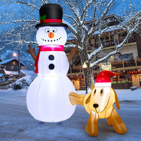 Glowing inflatable snowman and dog with internal white LED lights shining at night, creating a magical Christmas yard display