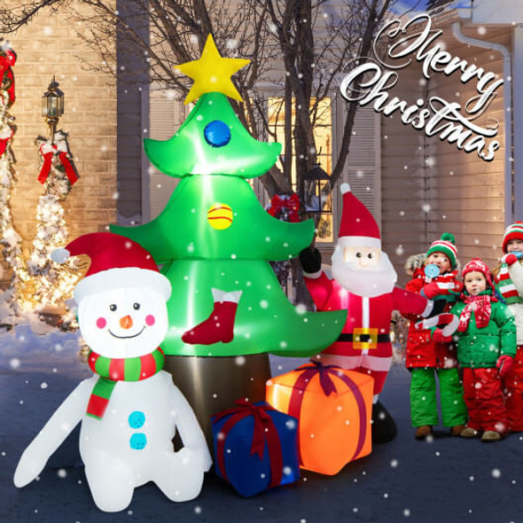 Multicolor LED lights glowing on 7.2 ft inflatable Santa and Christmas tree at night, illuminating outdoor holiday yard