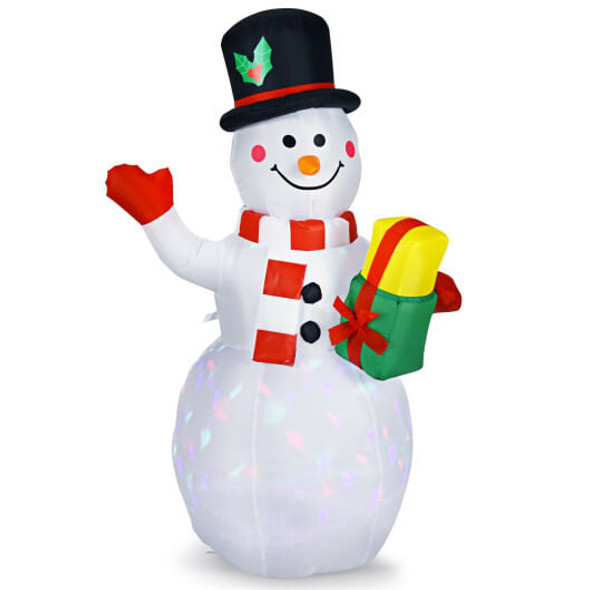 5 foot tall LED snowman inflatable glowing in a front yard at night with colorful lights and snow falling gently in the background