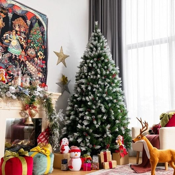 Person setting up 7.5 ft hinged Christmas tree with hinged PVC branches expanding for easy assembly, showcasing hassle-free setup process.