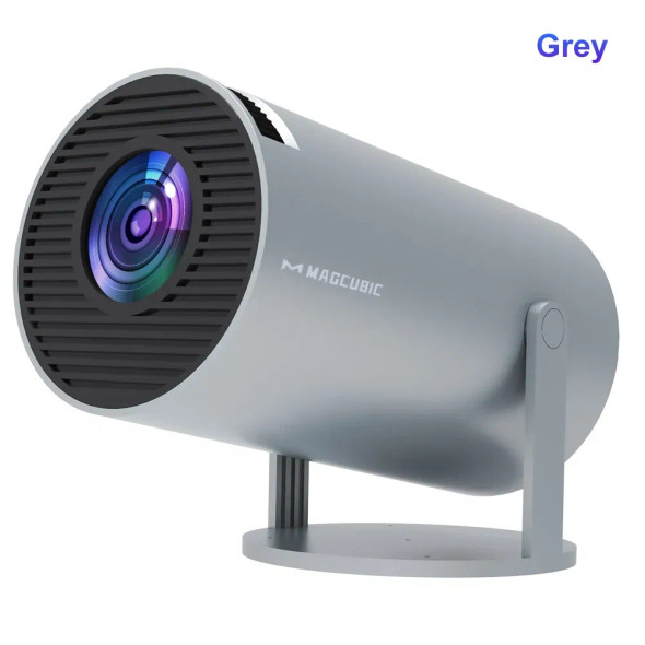 Magcubic HY300 Pro smart projector with Android 11 and 180-degree rotating mount placed on a modern wooden table, showing lens and controls clearly. Magcubic HY300 Pro smart projector with Android 11 and 180-degree rotating mount placed on a modern wooden table, showing lens and controls clearly.