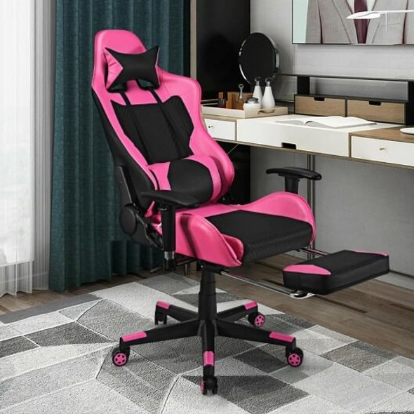Ergonomic pink gaming chair shown fully reclined with footrest extended and massage lumbar pillow activated via USB plug.