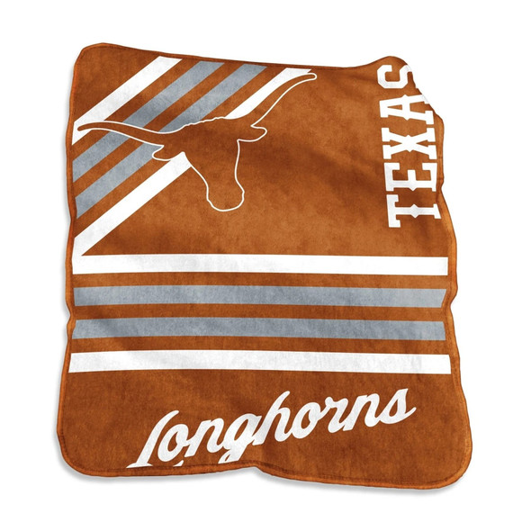 Texas Longhorns NCAA licensed 50×60 raschel throw blanket displayed on a couch, showing bold burnt orange color and white Longhorns logo, ideal for dorms, tailgates, or game day comfort Texas Longhorns NCAA licensed 50×60 raschel throw blanket displayed on a couch, showing bold burnt orange color and white Longhorns logo, ideal for dorms, tailgates, or game day comfort
