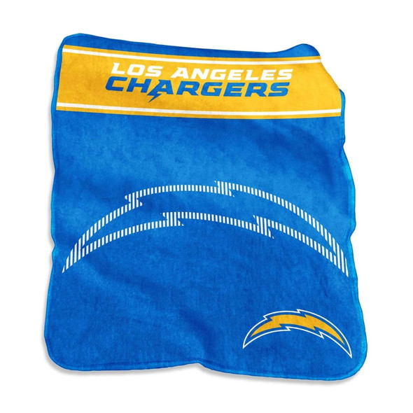 Los Angeles Chargers oversized 60Ă—80 Raschel throw blanket draped over a couch, showing bold team logo and vibrant NFL colors in a cozy game day living room setup Los Angeles Chargers oversized 60Ă—80 Raschel throw blanket draped over a couch, showing bold team logo and vibrant NFL colors in a cozy game day living room setup