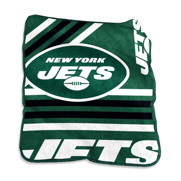 Official New York Jets Raschel Throw Blanket displayed folded on a sofa, showcasing bold team logo and green-and-white sublimated design — plush fleece texture highlighted for cozy and premium appeal Official New York Jets Raschel Throw Blanket displayed folded on a sofa, showcasing bold team logo and green-and-white sublimated design — plush fleece texture highlighted for cozy and premium appeal
