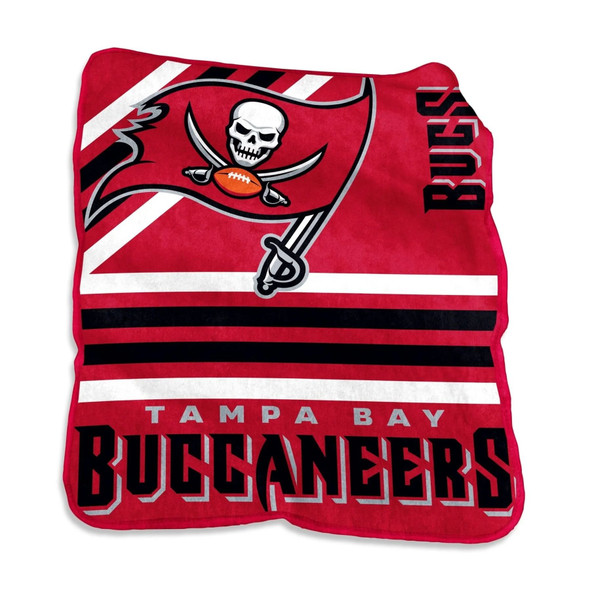 Official Tampa Bay Buccaneers Raschel Throw Blanket folded on a couch, showcasing bold red team logo and soft plush texture — perfect NFL fan gift or game day accessory Official Tampa Bay Buccaneers Raschel Throw Blanket folded on a couch, showcasing bold red team logo and soft plush texture — perfect NFL fan gift or game day accessory