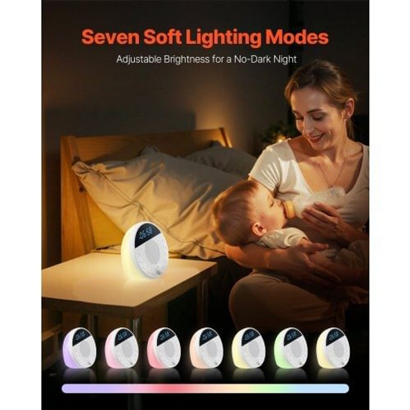 Baby sleeping peacefully in a crib with sound machine and soft night light illuminating the nursery
