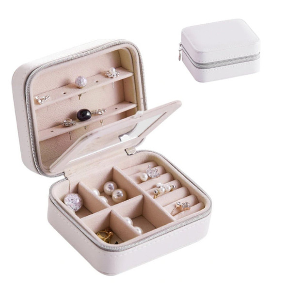Cool Jewels palm-sized compact jewelry box in rose gold, open to display neatly organized rings, earrings, and necklaces in multiple compartments, travel-friendly and gift-ready.