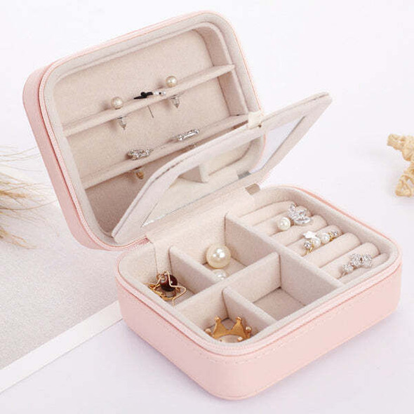 Cool Jewels palm-sized compact jewelry box in rose gold, open to display neatly organized rings, earrings, and necklaces in multiple compartments, travel-friendly and gift-ready.