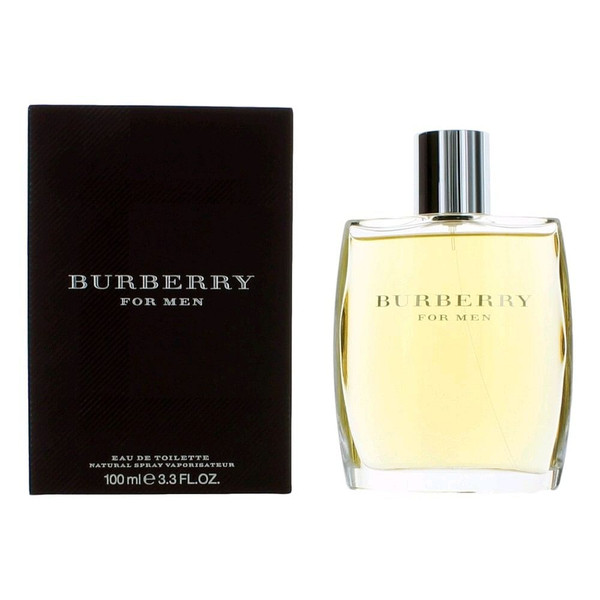 Clear glass bottle of Burberry by Burberry Men’s Eau de Toilette Spray, 3.3 oz, standing upright on a reflective surface with soft shadows and warm lighting, showcasing the iconic minimalist label and silver-tone cap — a premium designer fragrance for men.
