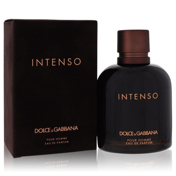 A close-up of a Dolce & Gabbana Intenso Eau de Parfum 4.2 oz bottle placed on a dark wooden surface, with soft lighting highlighting the deep brown glass and metallic logo, evoking a sense of masculine elegance and luxury.