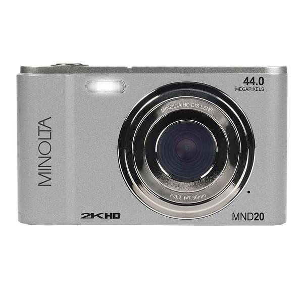 Minolta MND20‑S Digital Camera in silver, front view, showing LCD display, compact design, and sleek finish for beginners and travel photography.