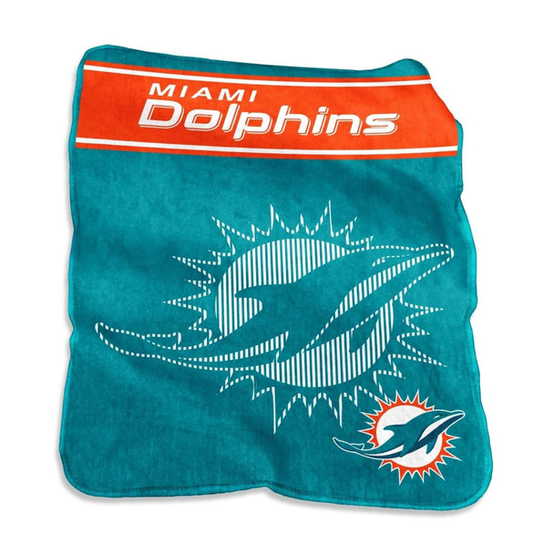 Official Miami Dolphins 60×80 Raschel Throw Blanket draped over a modern gray sofa, showcasing vibrant team colors and bold logo design, emphasizing oversized plush comfort for game-day lounging or home décor.