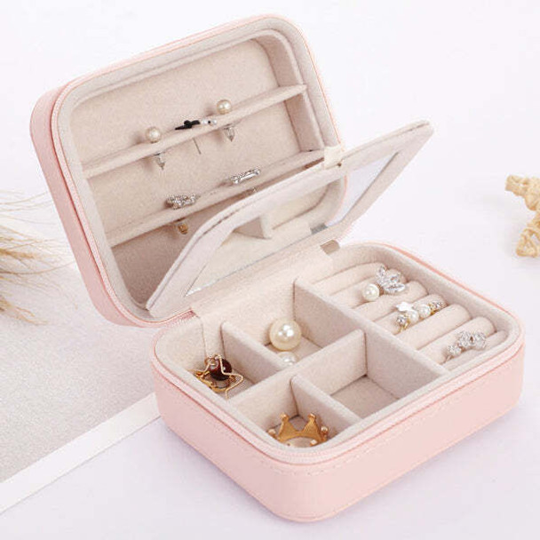 Cool Jewels palm-sized compact jewelry box in rose gold, open to display neatly organized rings, earrings, and necklaces in multiple compartments, travel-friendly and gift-ready.