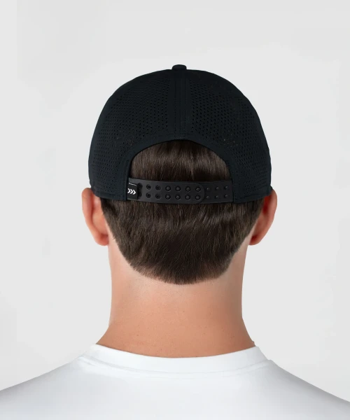 Back view of man wearing black performance snapback