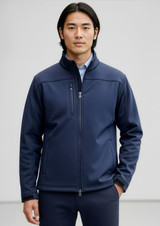 A navy men's softshell jacket with a high collar and zippered pockets, featuring a logo on the chest.