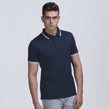 A navy polo shirt with contrasting white collar and sleeve trims, featuring a logo on the chest. A navy polo shirt with contrasting white collar and sleeve trims, featuring a logo on the chest.