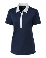 A navy blue ladies' polo shirt with a white collar and buttons, featuring a logo on the front. A navy blue ladies' polo shirt with a white collar and buttons, featuring a logo on the front.