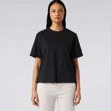 A black T-shirt displayed on a model, featuring a relaxed fit and short sleeves, without any visible logos.
