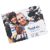 A fridge magnet featuring a colourful design with two smiling individuals, showcasing vivid hues and a glossy finish.