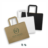 A set of three medium flat handle paper bags in black, white, and brown with a logo on the front. A set of three medium flat handle paper bags in black, white, and brown with a logo on the front.