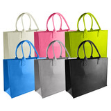 Avenue Felt Shopper tote bags in white, pink, lime green, blue, grey, and black, featuring dual handles and an internal logo.
