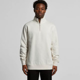 A man is wearing a cream-coloured half zip crew jumper with a relaxed fit, featuring a stand-up collar. A man is wearing a cream-coloured half zip crew jumper with a relaxed fit, featuring a stand-up collar.